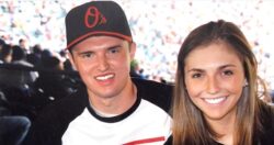 Alex at baseball game with sister