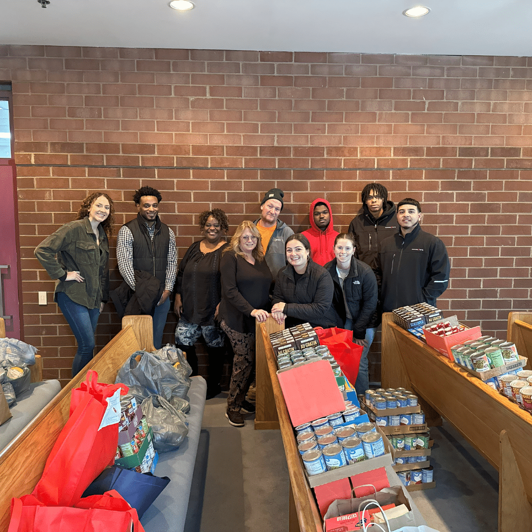 BPG Cares: 2024 Holiday Food Drive donations BPG associates with staff of Neighborhood House